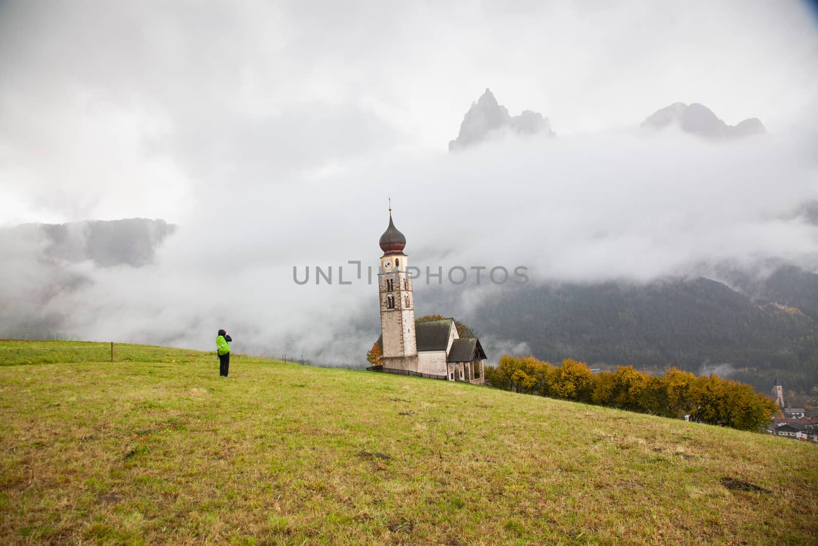 san Valentino church on a foggy late autumn day, Siusi allo Sciliar, Castelrotto, Dolomites, Italy