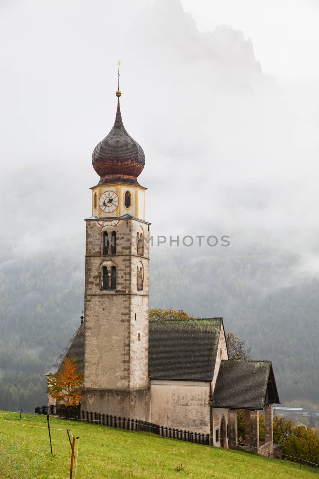 san Valentino church on a foggy late autumn day, Siusi allo Sciliar, Castelrotto, Dolomites, Italy