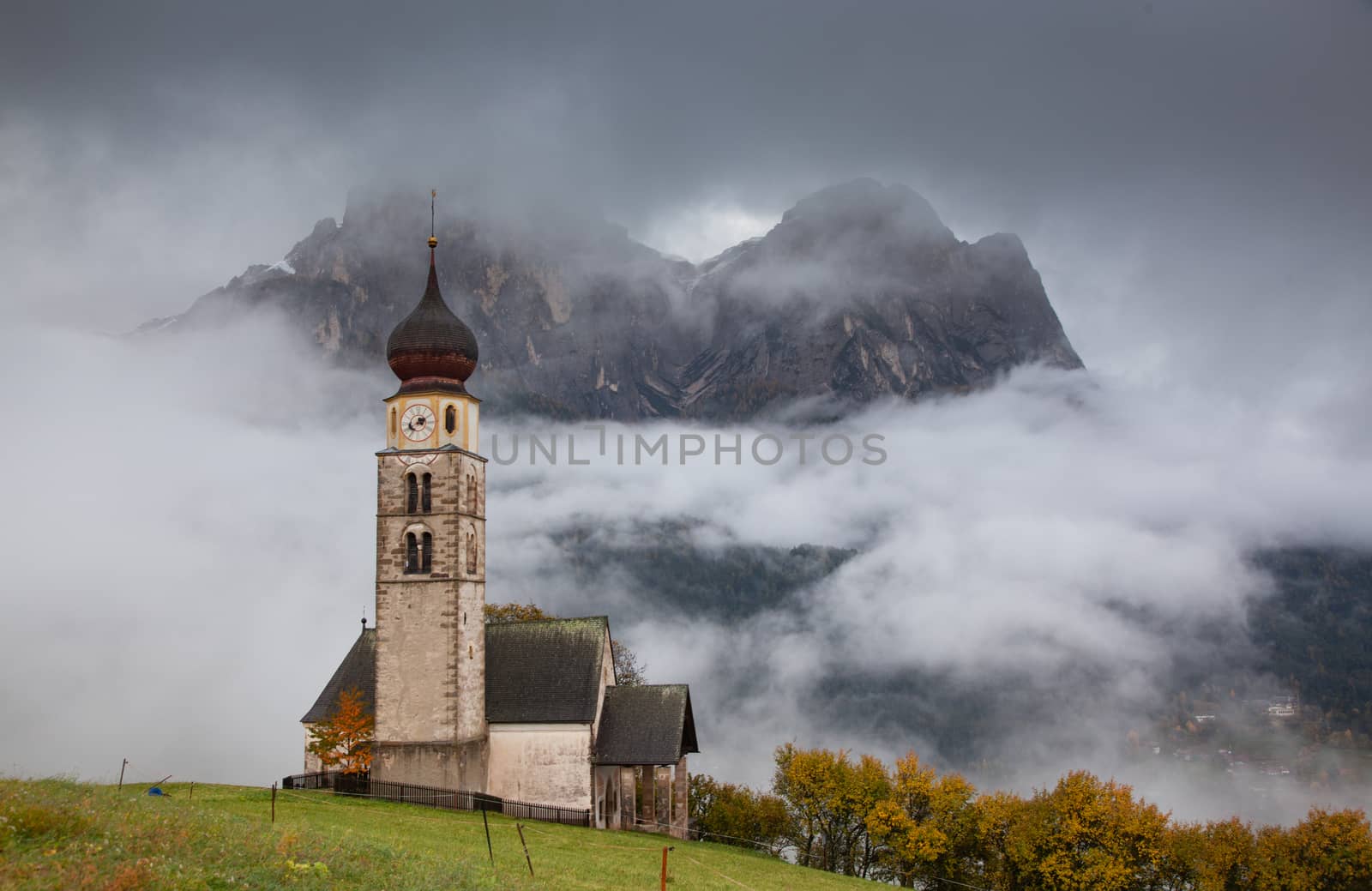 san Valentino church on a foggy late autumn day, Siusi allo Sciliar, Castelrotto, Dolomites, Italy