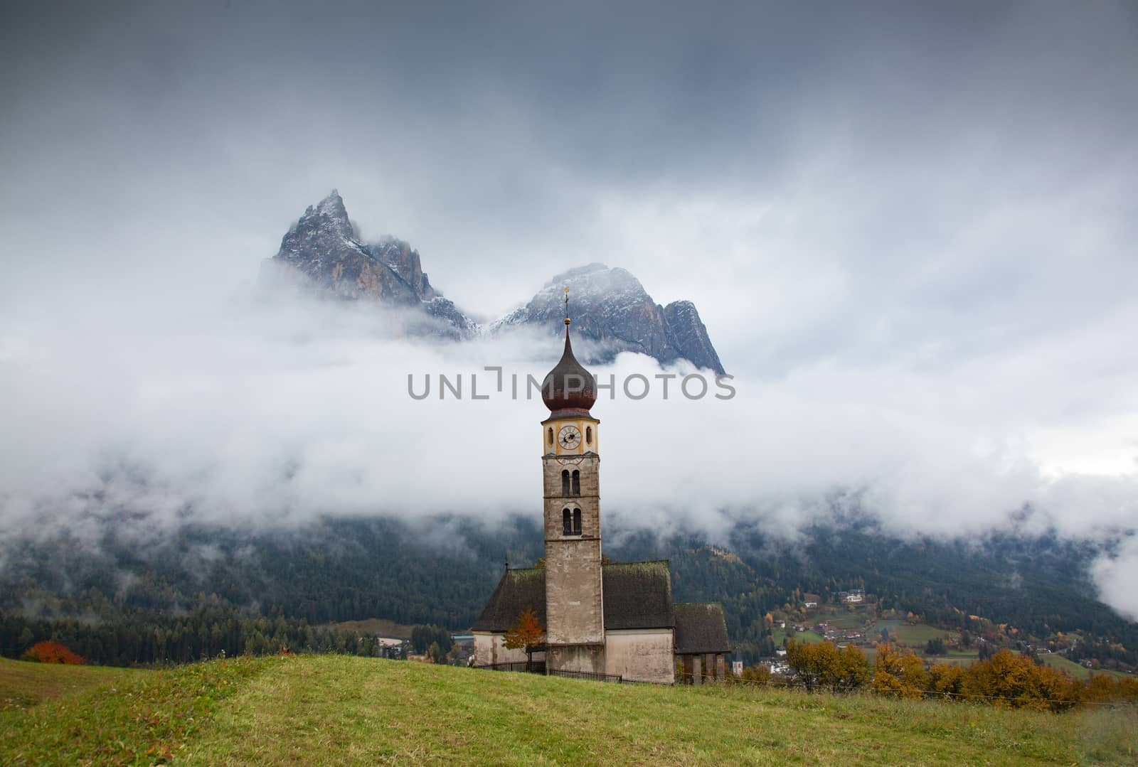 san Valentino church on a foggy late autumn day, Siusi allo Sciliar, Castelrotto, Dolomites, Italy