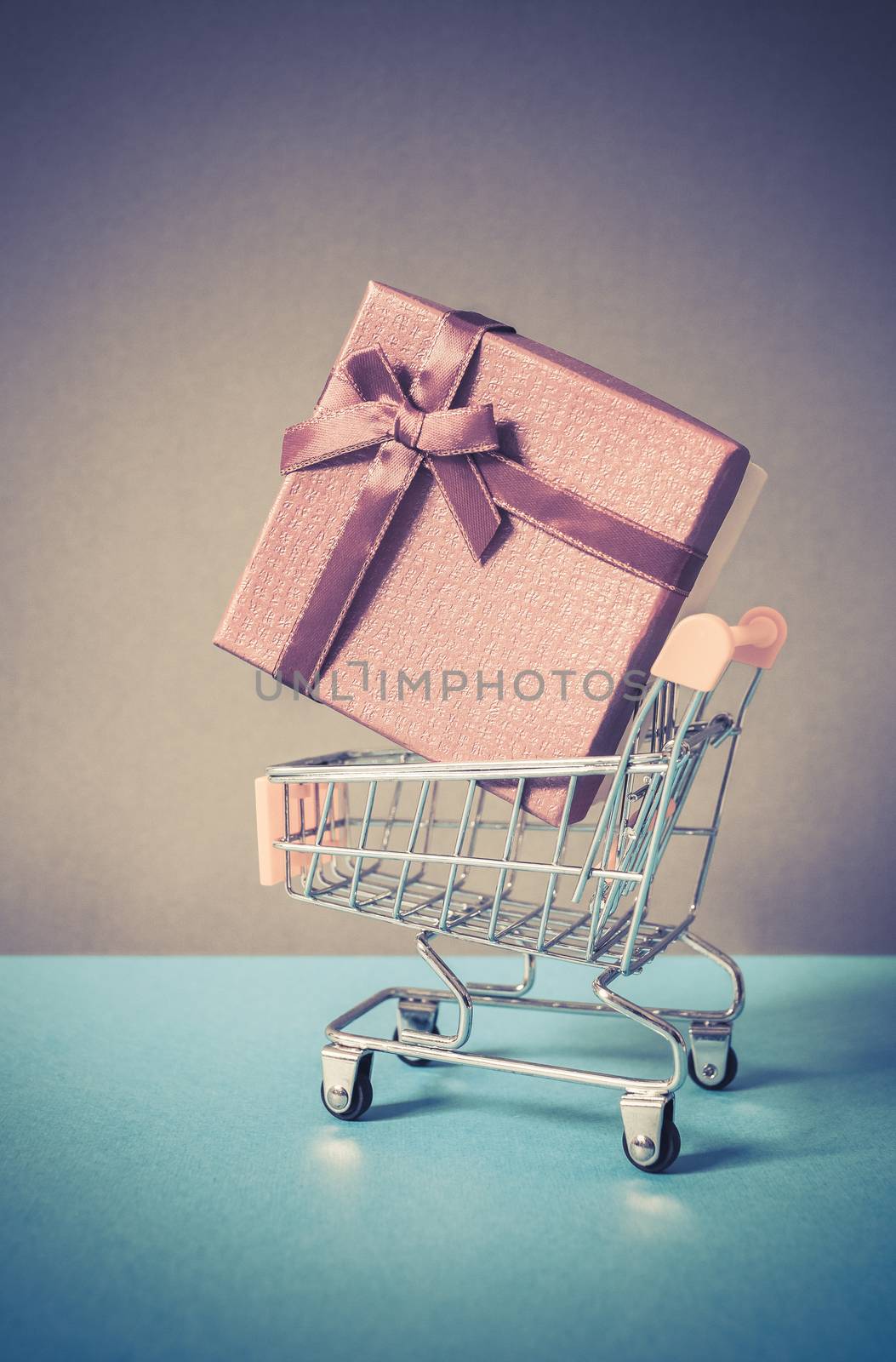 huge red gift box in shopping cart - online shopping by melis