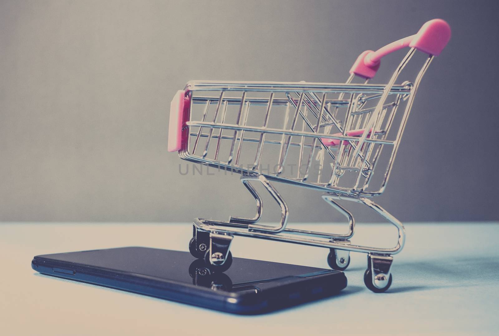 shopping cart on smartphone - e-commerce