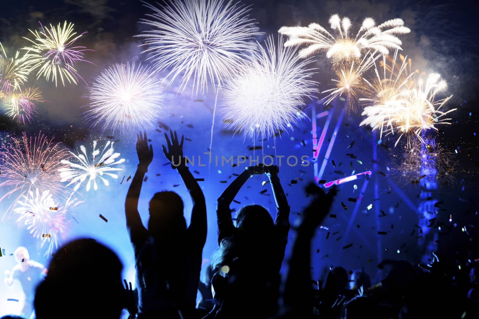 crowd watching fireworks - New Year celebrations- abstract holid by melis