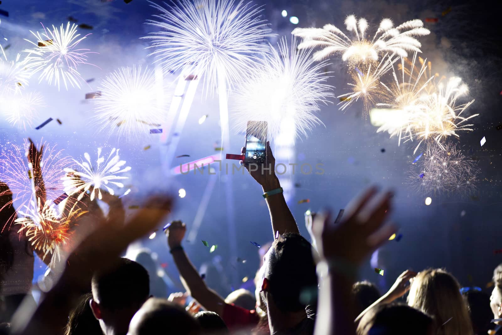 crowd watching fireworks - New Year celebrations- abstract holiday background