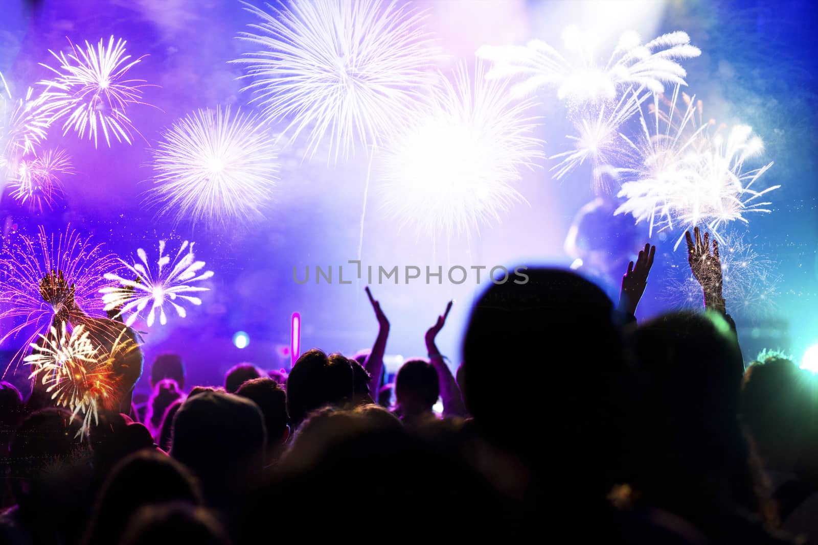 crowd watching fireworks - New Year celebrations- abstract holiday background