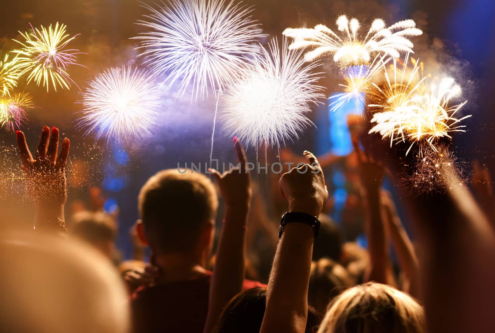 crowd watching fireworks - New Year celebrations- abstract holiday background