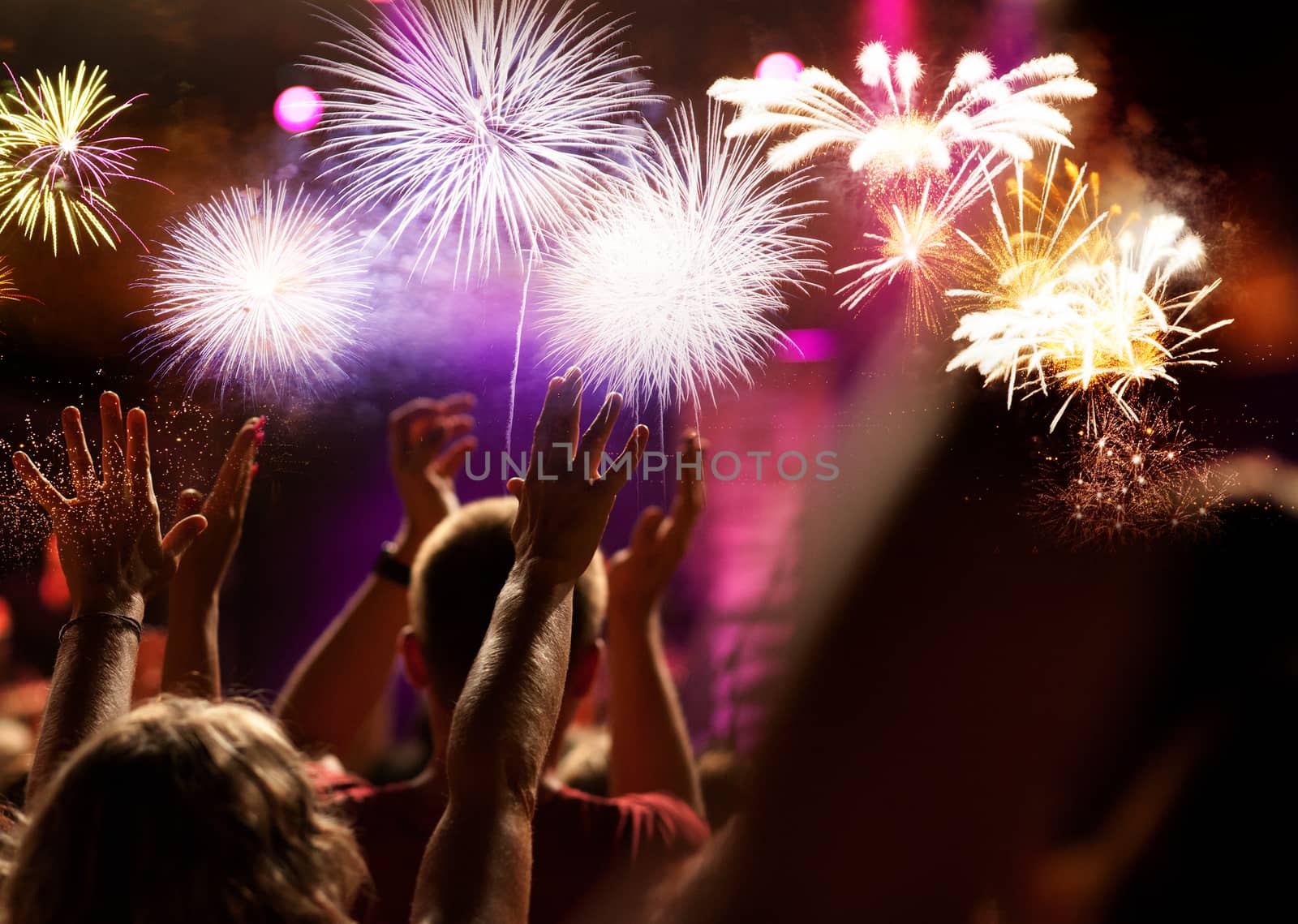 crowd watching fireworks - New Year celebrations- abstract holiday background