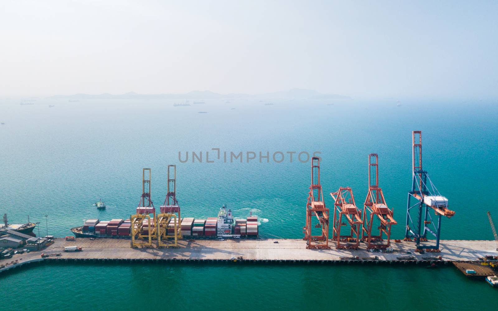 Aerial view of container ship in import - export business indust by antpkr