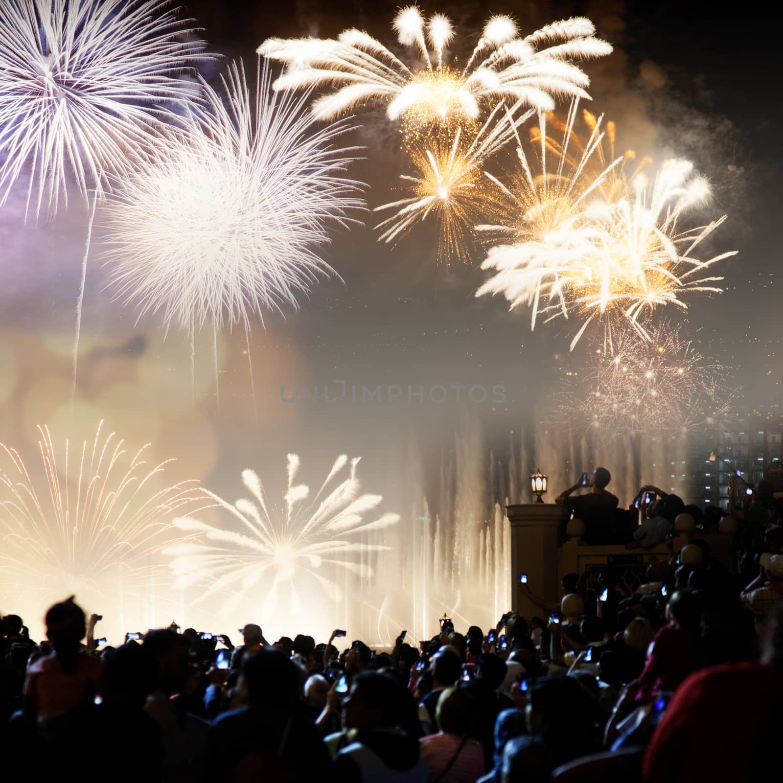 crowd watching fireworks - New Year celebrations- abstract holid by melis