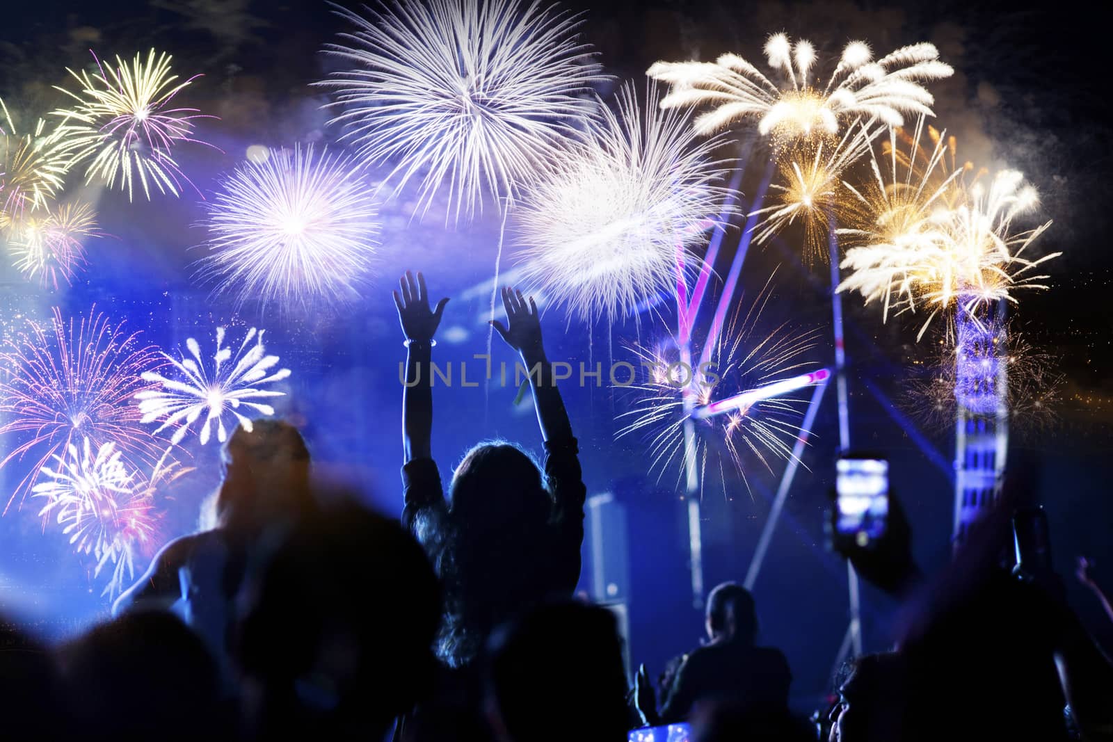 crowd watching fireworks - New Year celebrations- abstract holiday background