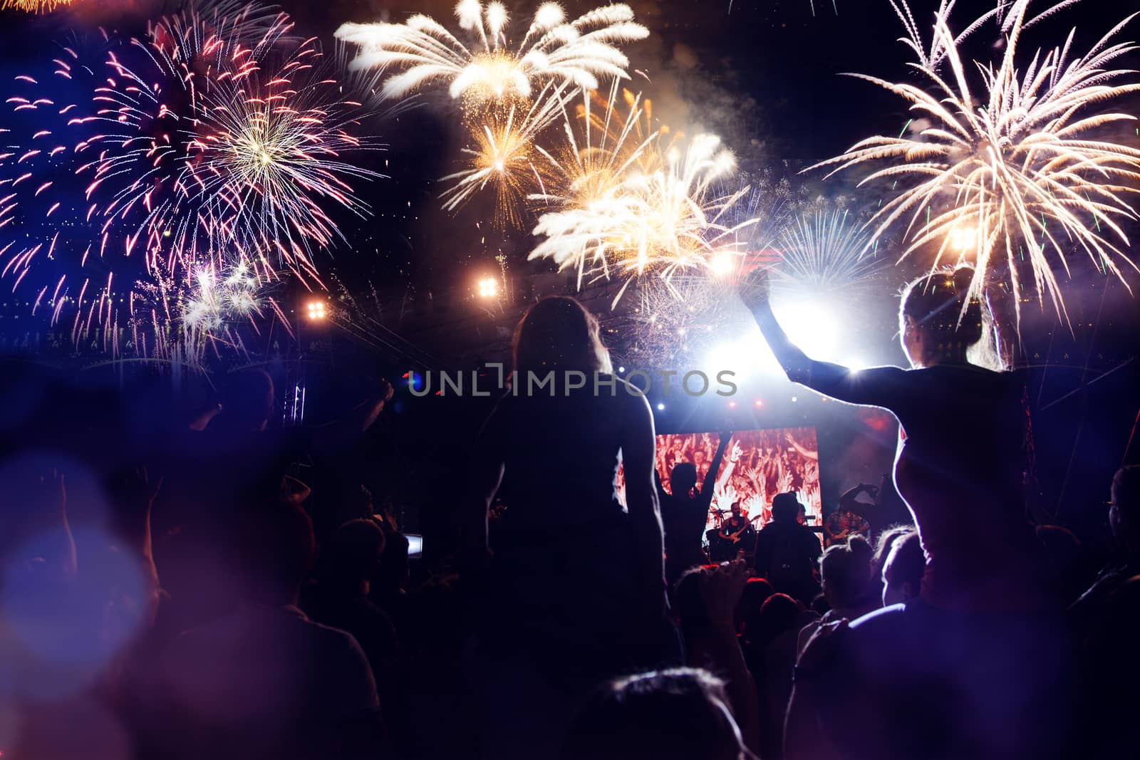 crowd watching fireworks - New Year celebrations- abstract holiday background