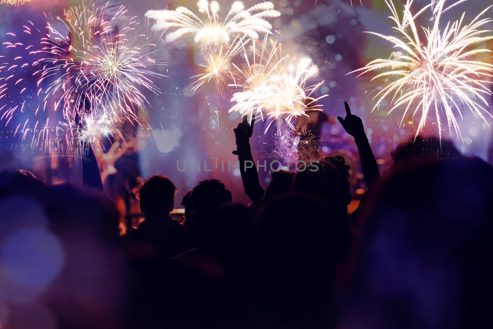 crowd watching fireworks - New Year celebrations- abstract holiday background