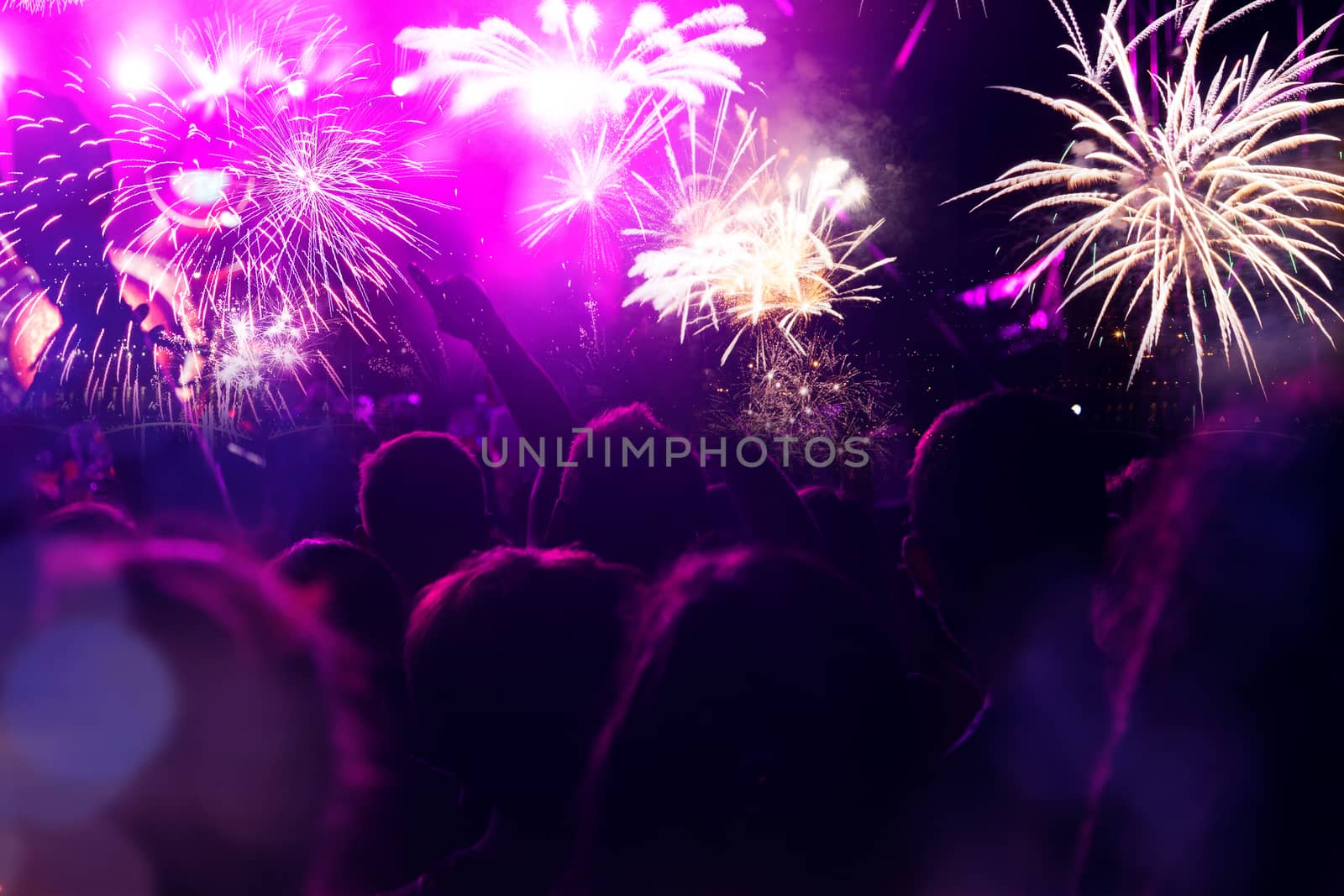 crowd watching fireworks - New Year celebrations- abstract holiday background