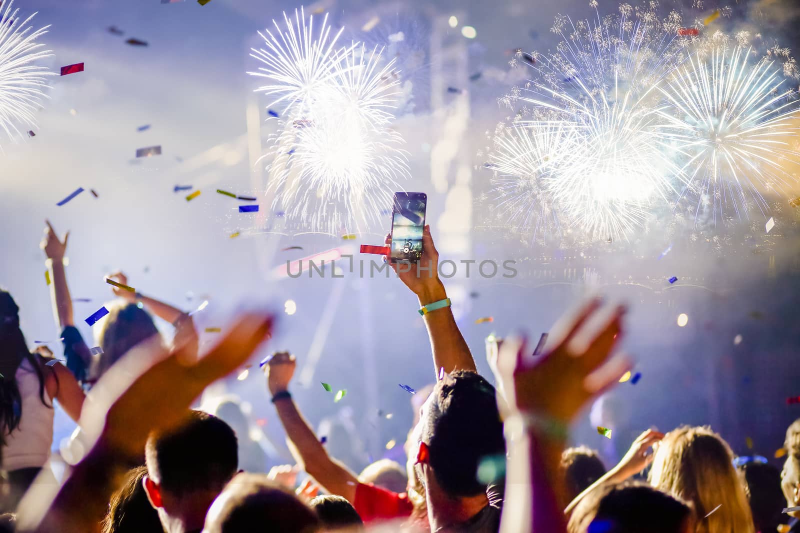 crowd watching fireworks - New Year celebrations- abstract holiday background