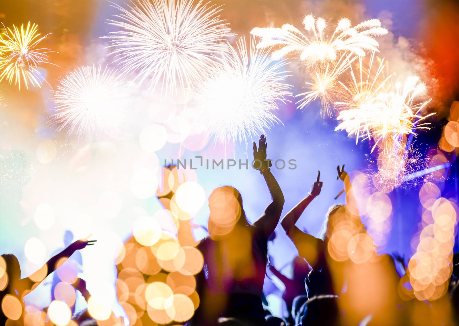 crowd watching fireworks - New Year celebrations- abstract holid by melis