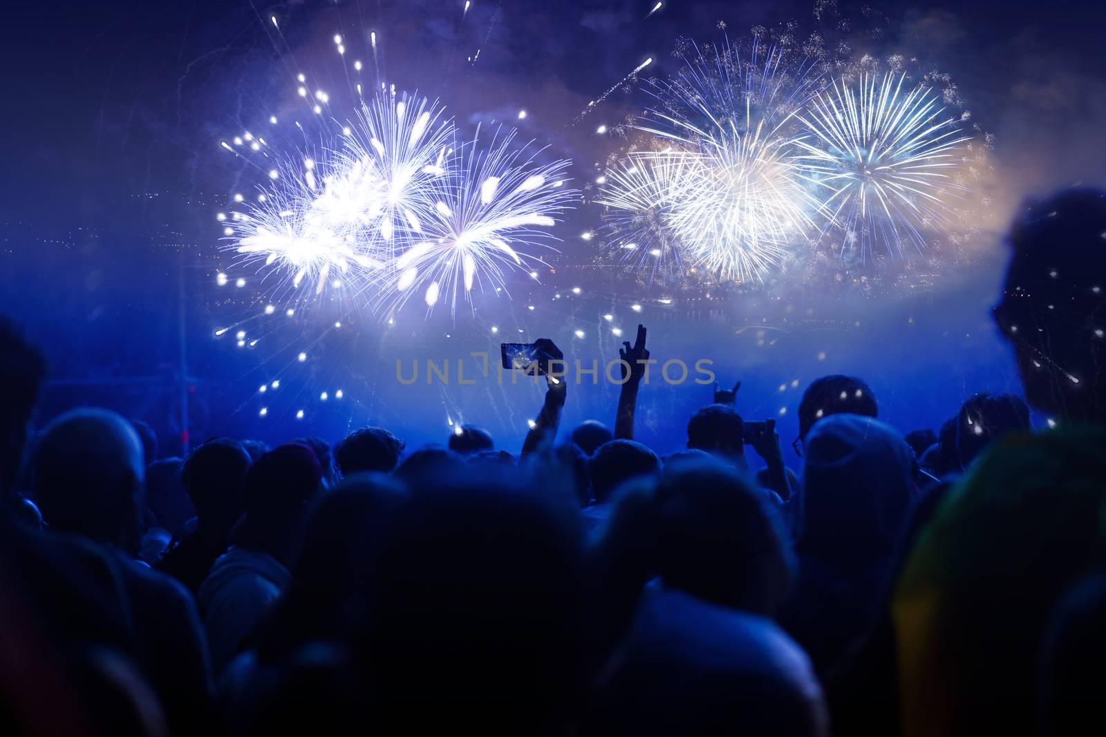 cheering crowd with raised hands at concert - music festival