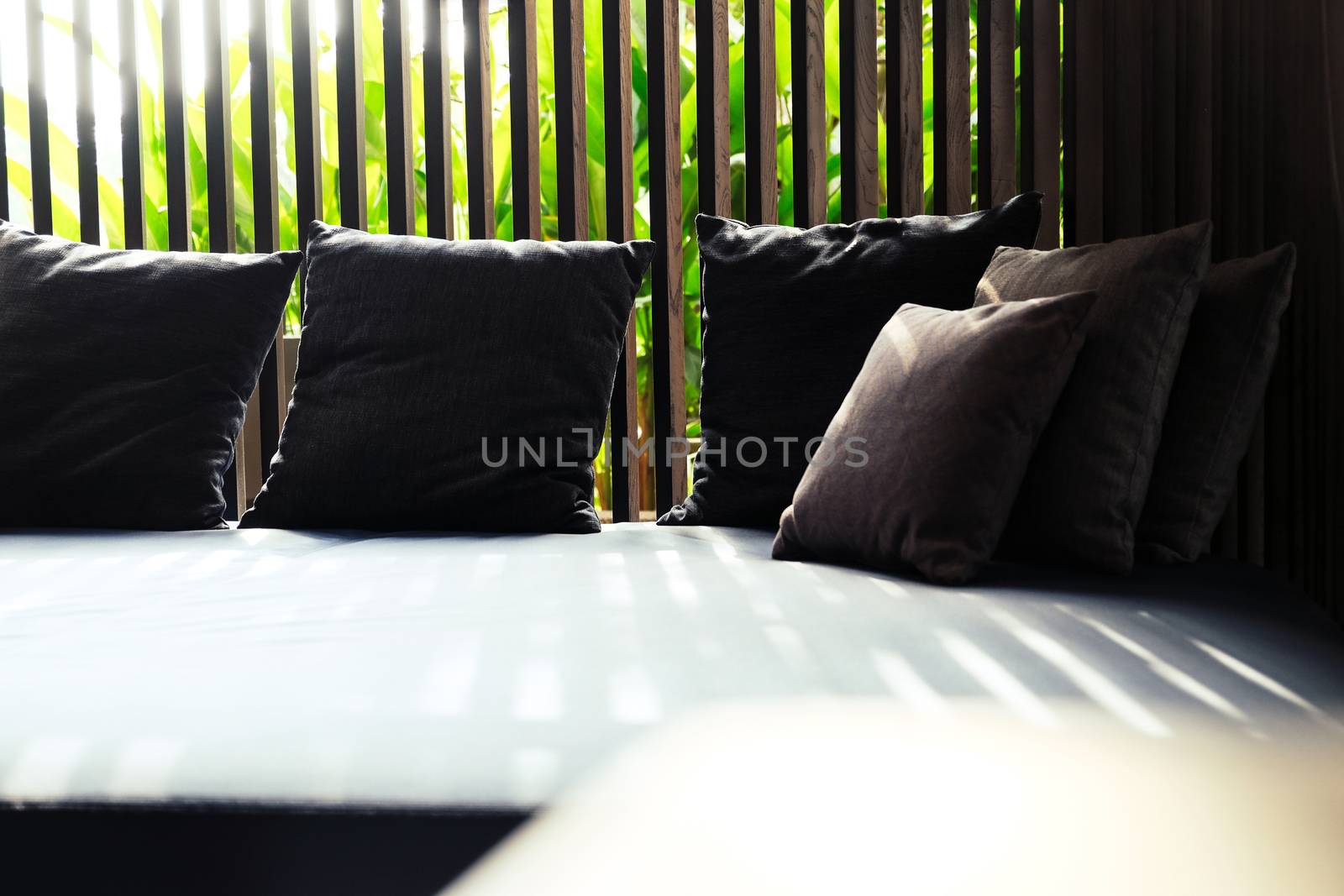 Detail of Modern living room interior with cozy sofa and pillows.