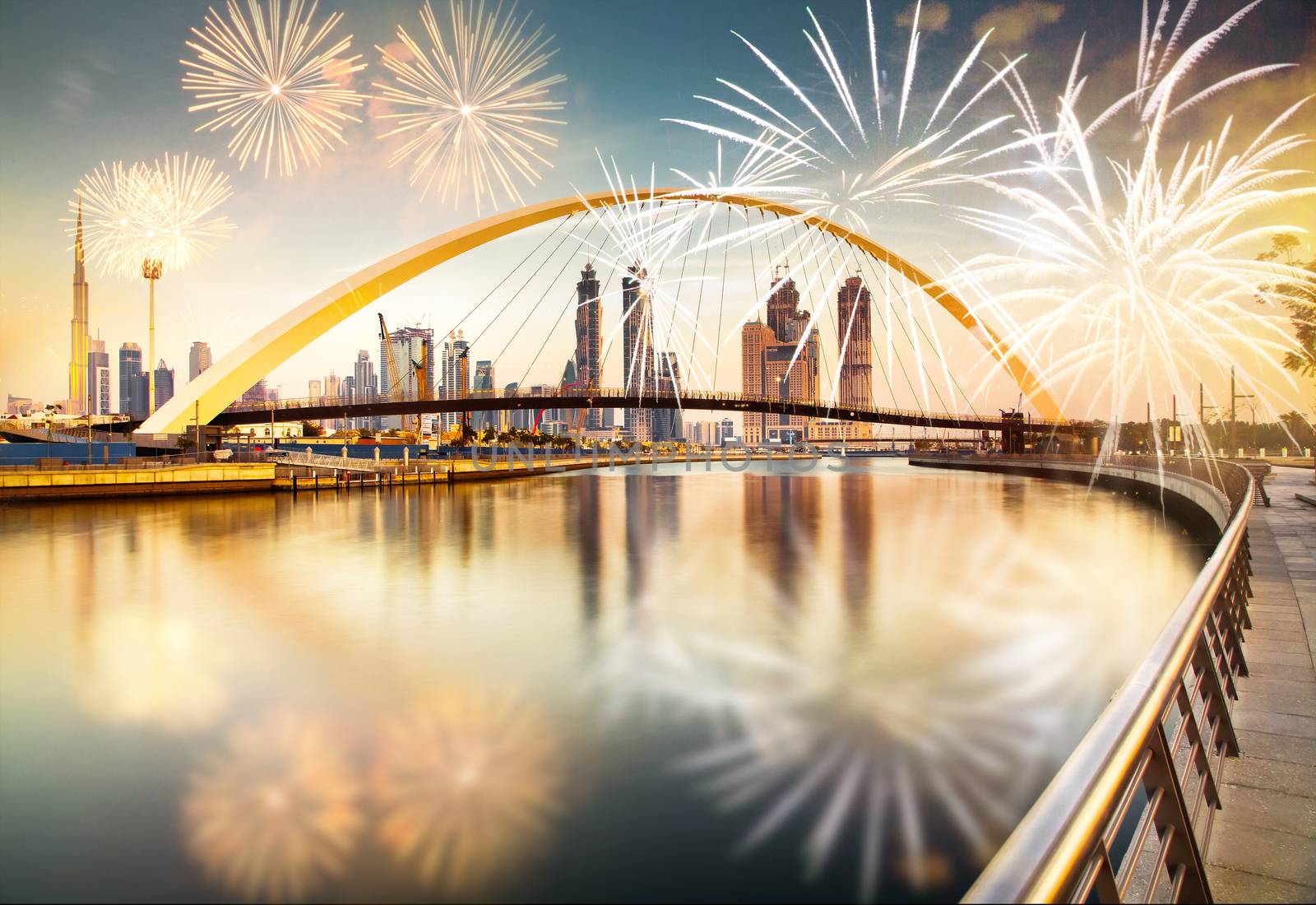 fireworks around Tolerance bridge - exotic New Year destination, Dubai, UAE
