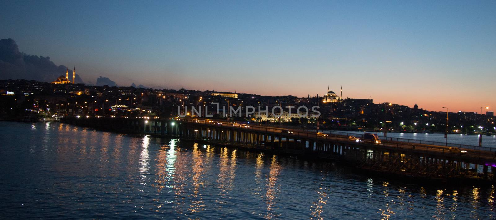 Ataturk bridge on Golden Horn at night on display