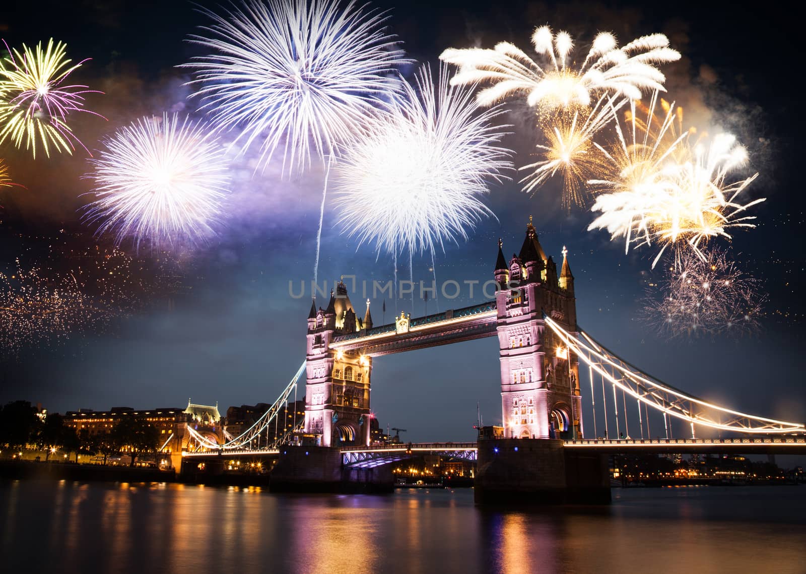 celebratory fireworks over Tower Bridge - New Year destination.  London.  UK