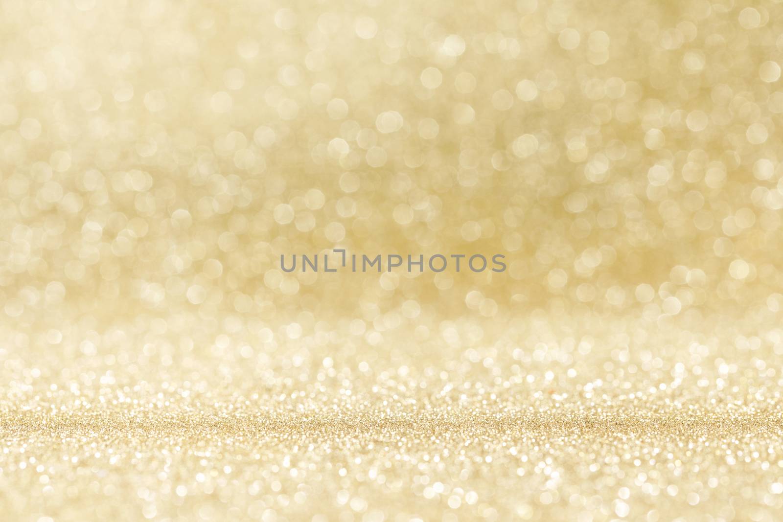 Abstract shining glitters gold holiday bokeh background with copy space for text