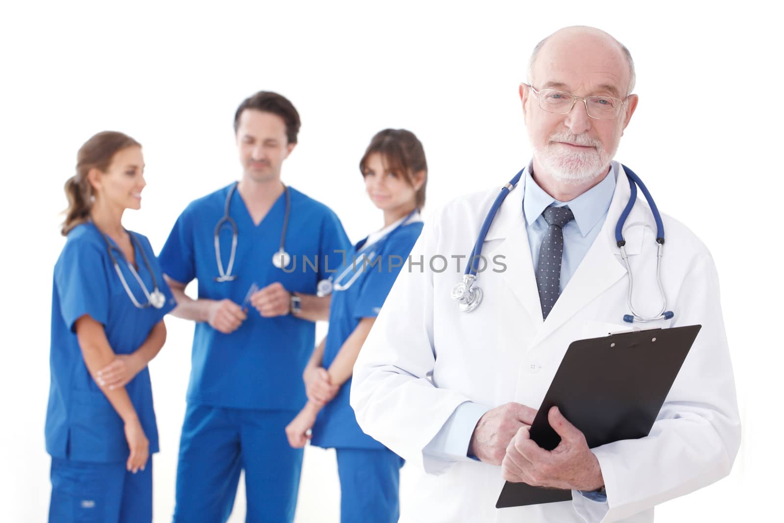 Smiling team of doctors and nurses on white background