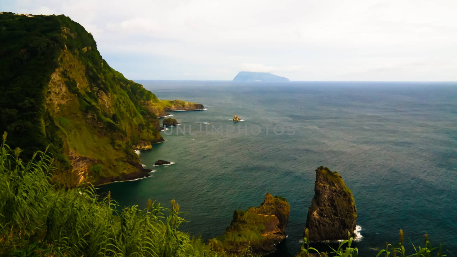 View to coastline of Flores island and Corvo island from Miradouro dos Caimbros, Azores, Portugal by homocosmicos