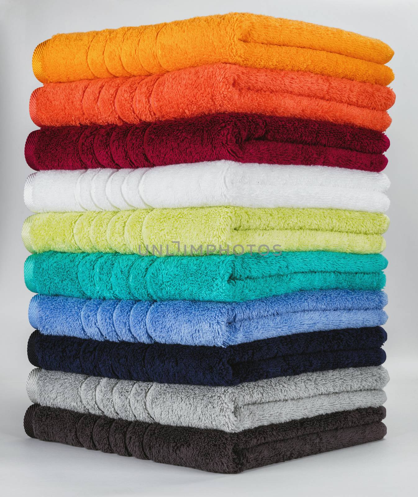 Multicolored towels on a white background by hanusst