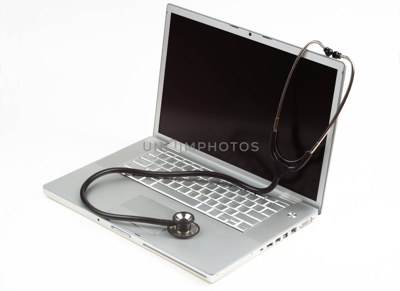 silver laptop diagnosis with black stethoscope  isolated on white background