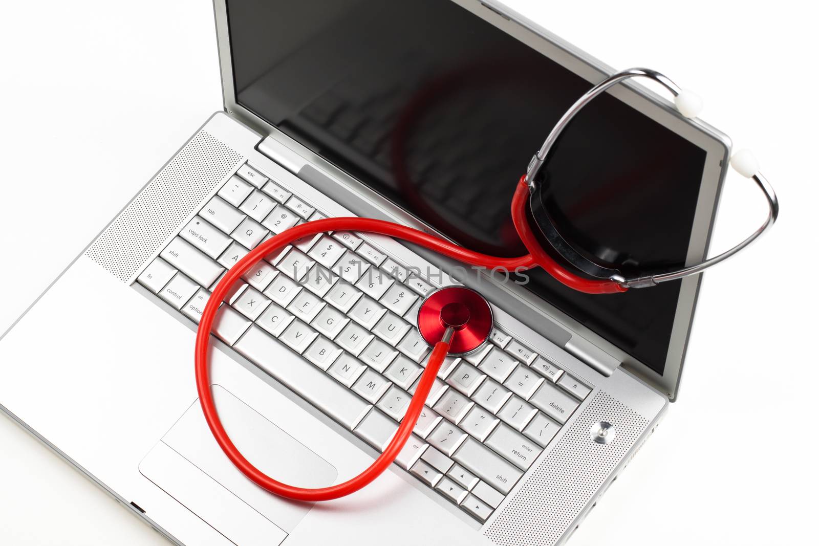 silver laptop diagnosis with red stethoscope crop isolated on white background