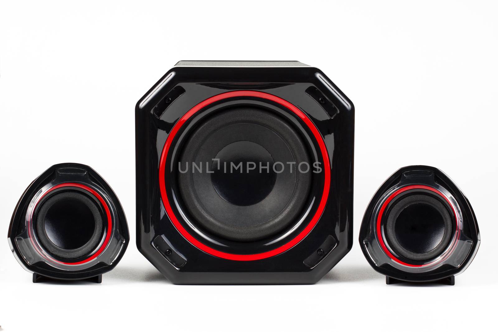 3D sound system build from 3 way speakers and a woofer all black with red circle isolated on white background