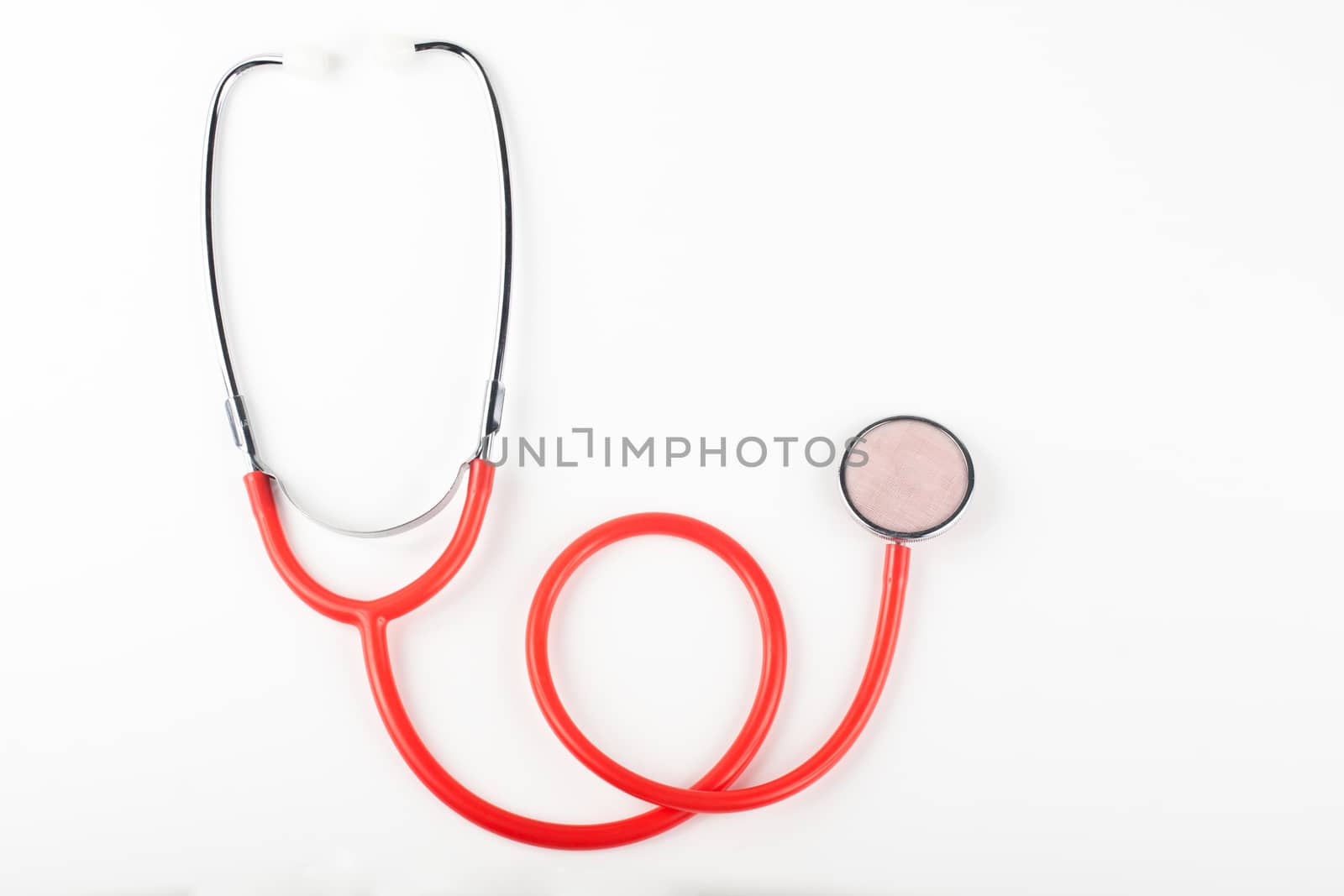 single red stethoscope isolated on white background