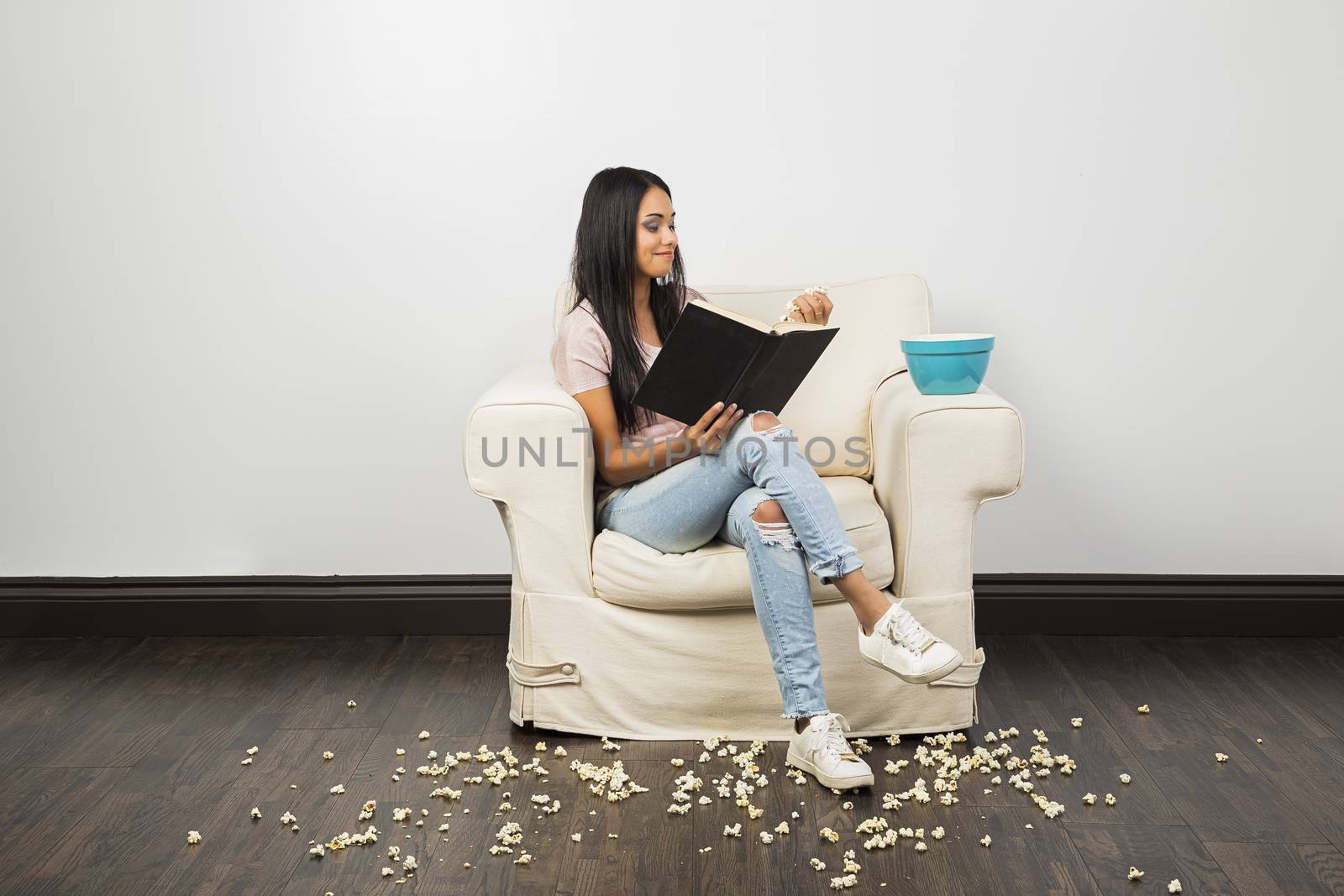 Reading and eating popcorn by mypstudio