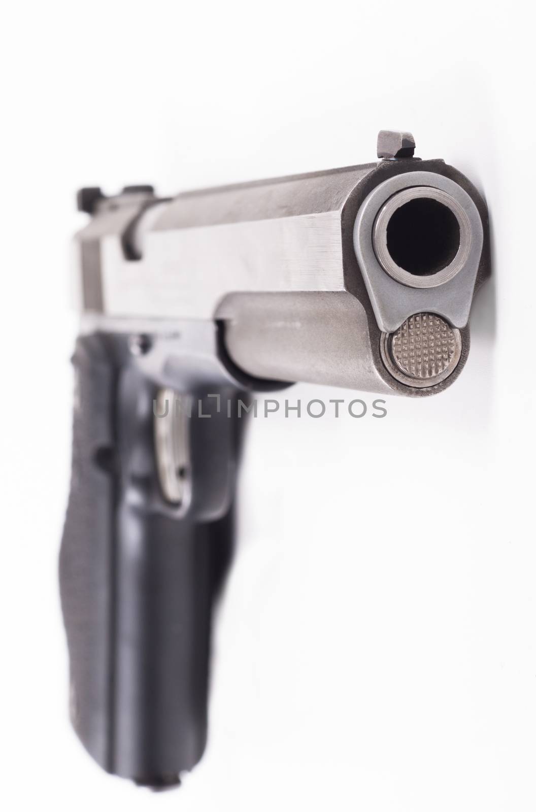 Silver color pistol closeup isolated on white background