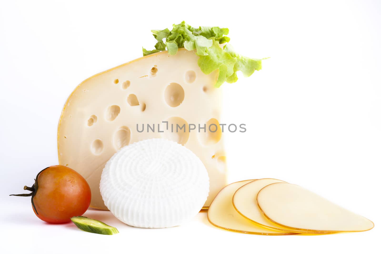 Yellow and white chese with tomato and cheese slices isolajted on white background