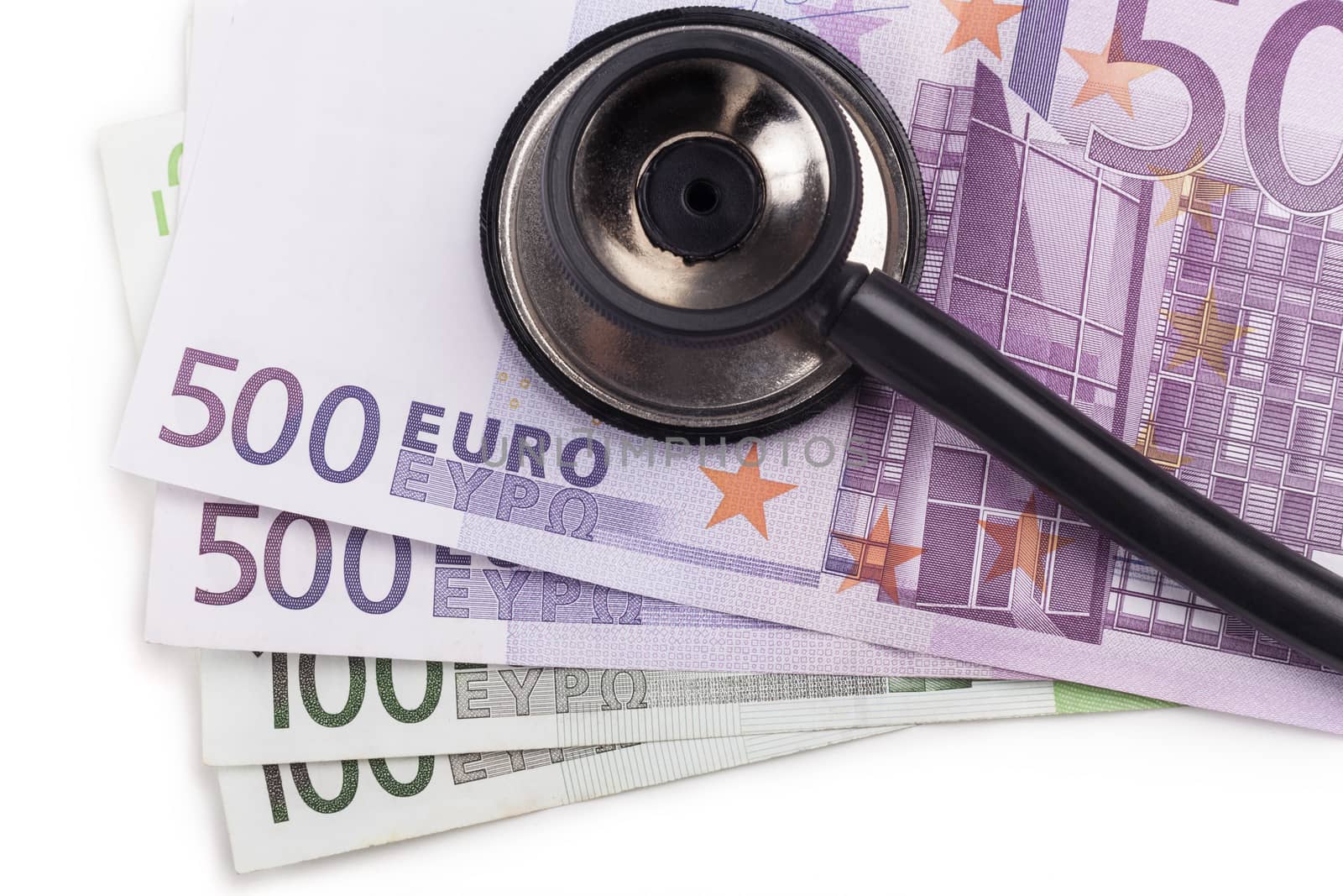 Black stethoscope close-up on top of euro bills isolated on white background