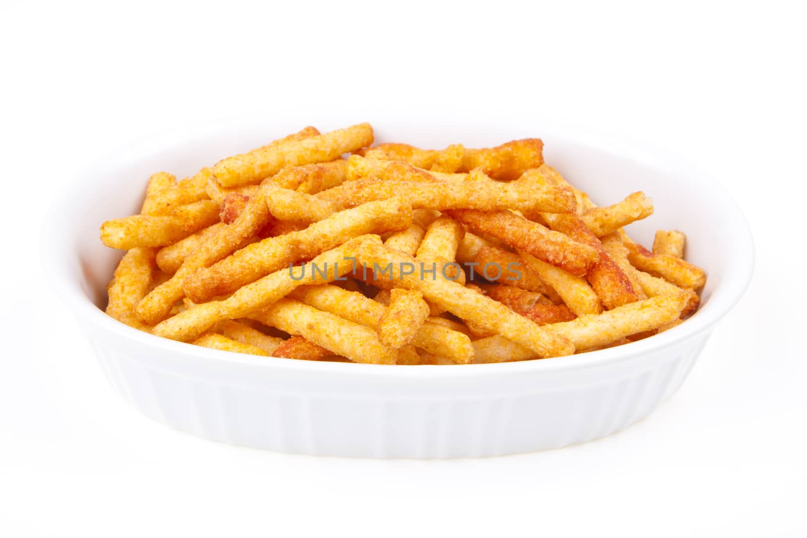 french fries in an elipric white bowl on white background