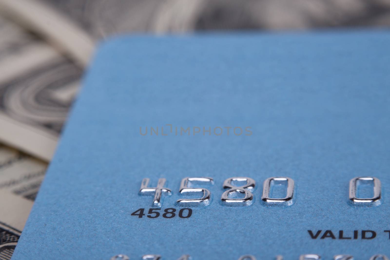 credit card numbers  close-up on money background