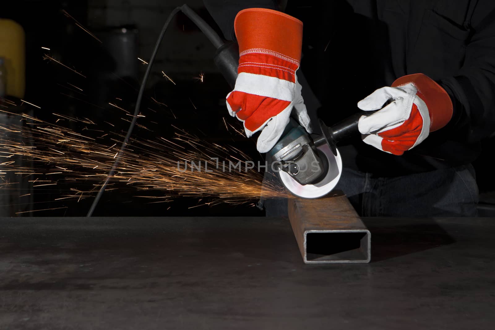 orange sparks during metal grinding in a steel factory