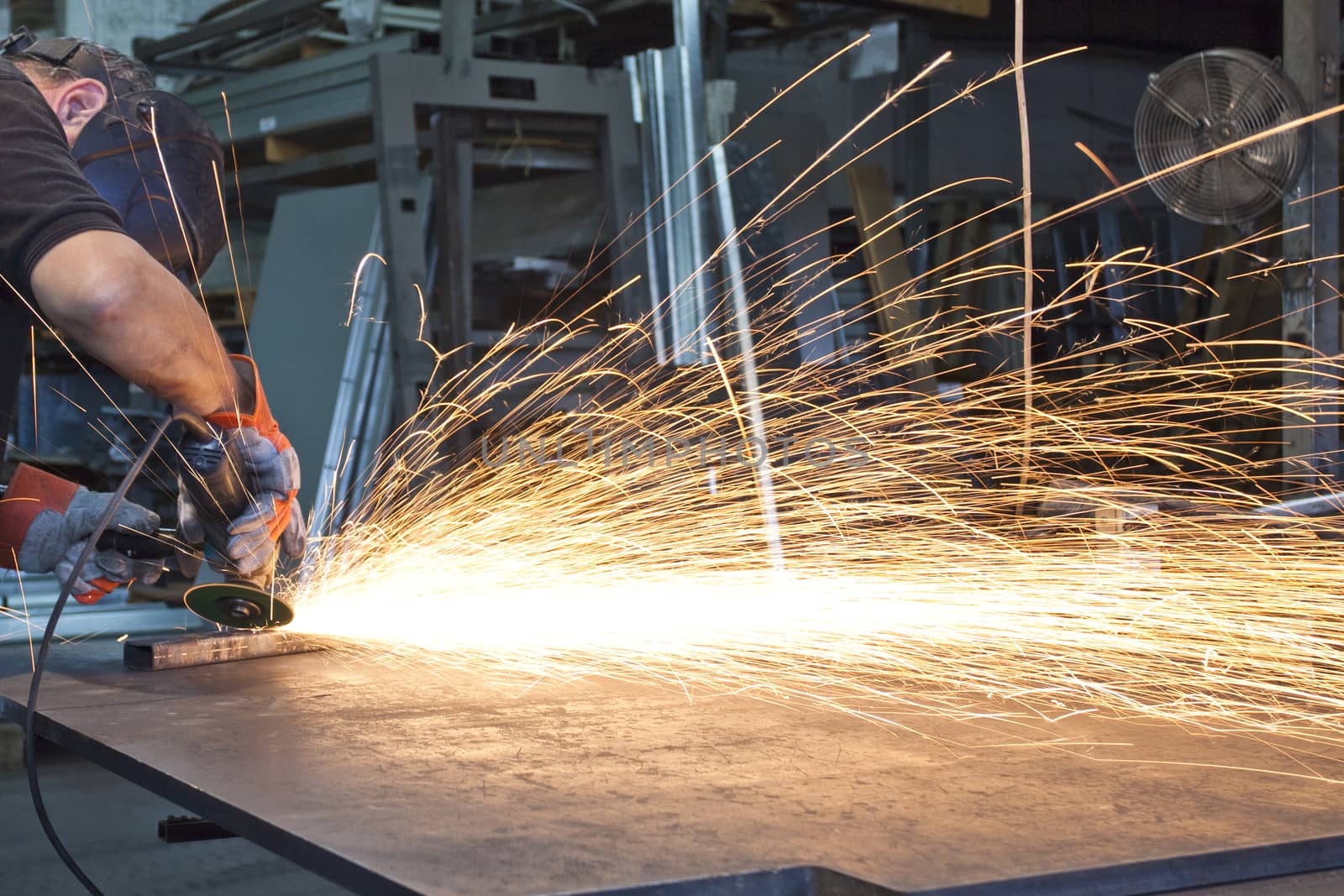 sparks during metal grinding in a steel factory 