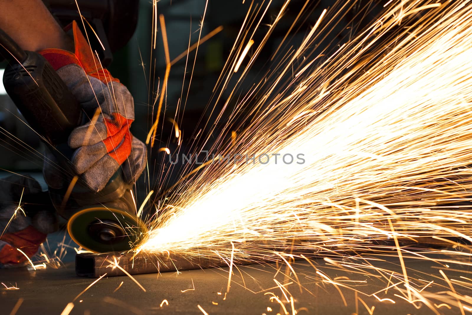 sparks while grinding in a steel factory