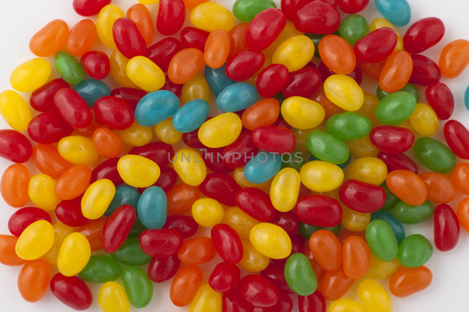 round shape colored candy pile on white background