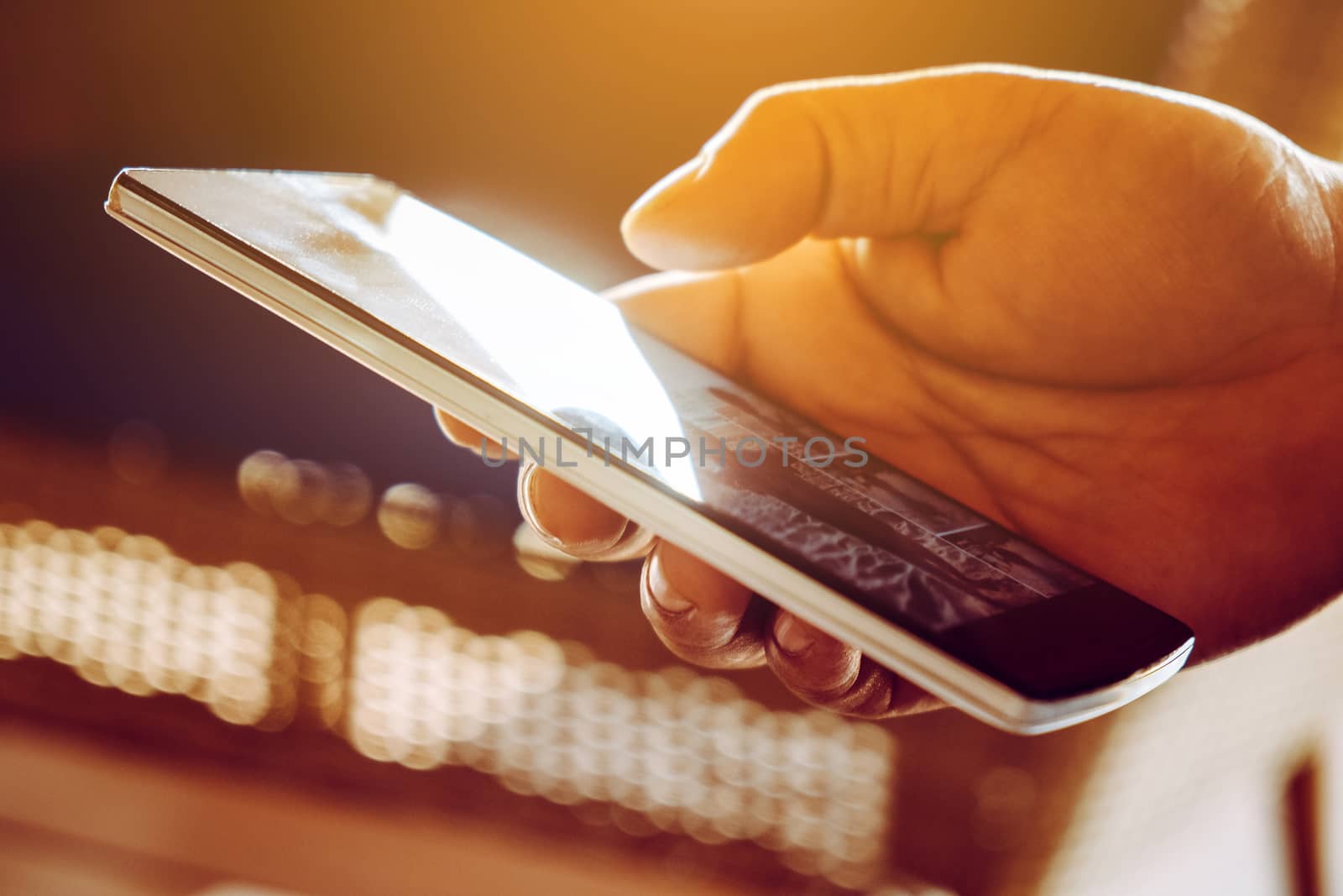 close up image of Phone on hands.