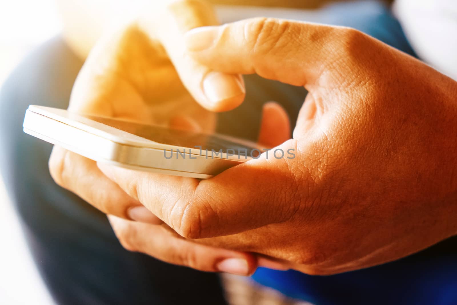 close up image of Phone on hands.
