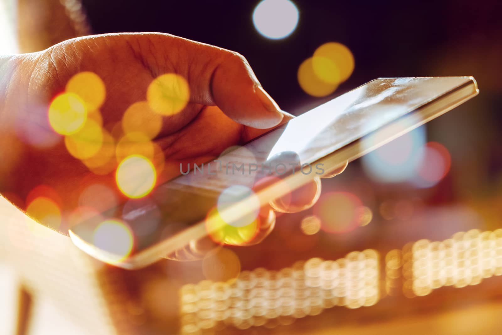 Double exposure of Phone on hands.