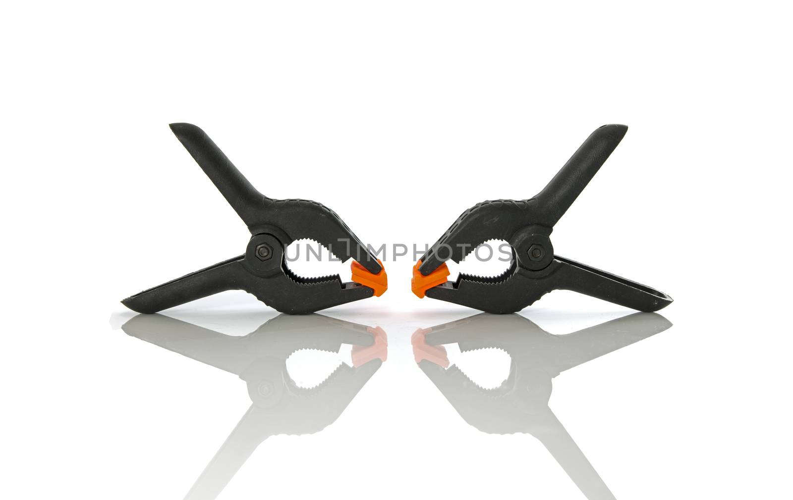 Plastic clamps for connecting parts on a white background