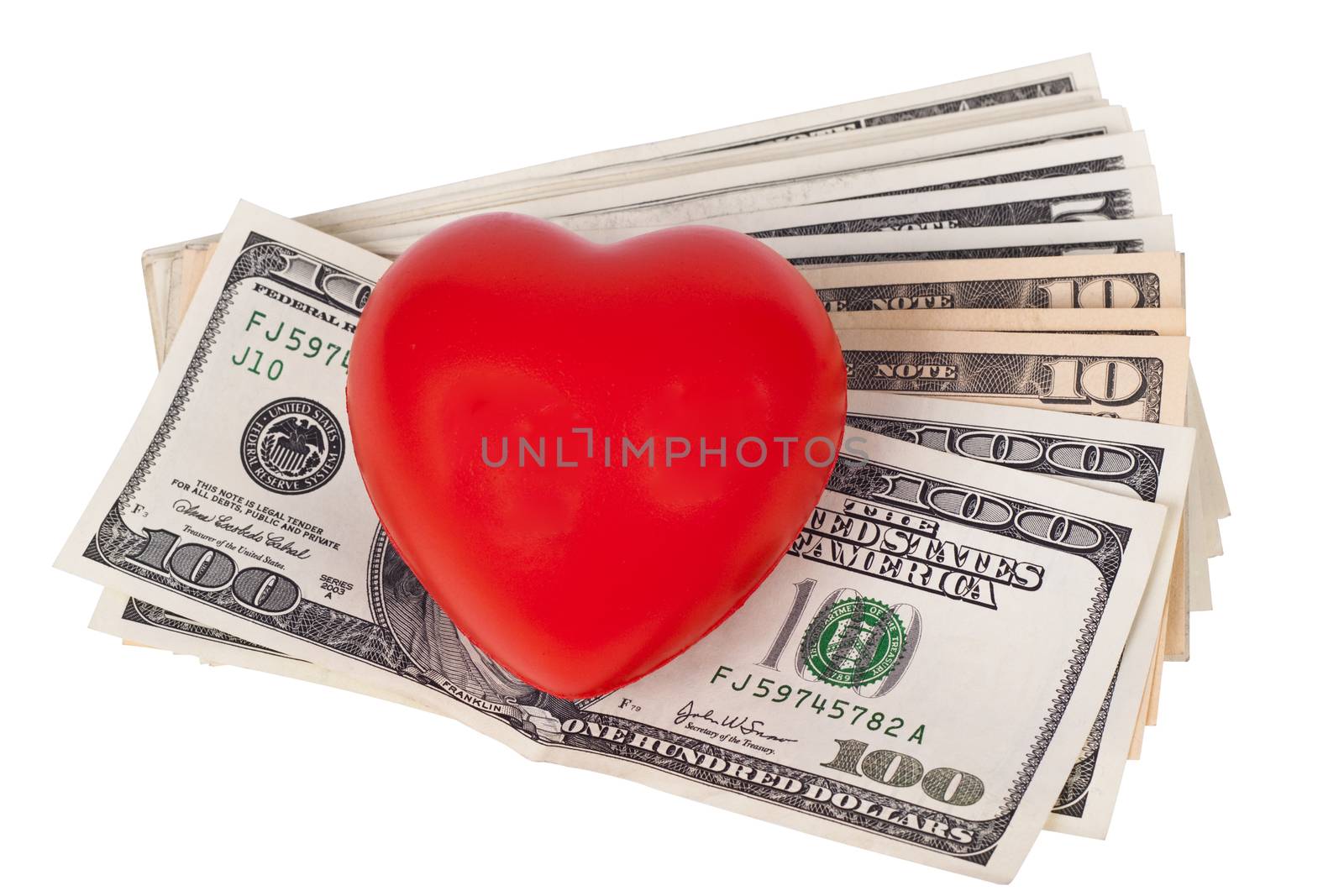 dollar bils with a red heart on the top isolated on white background