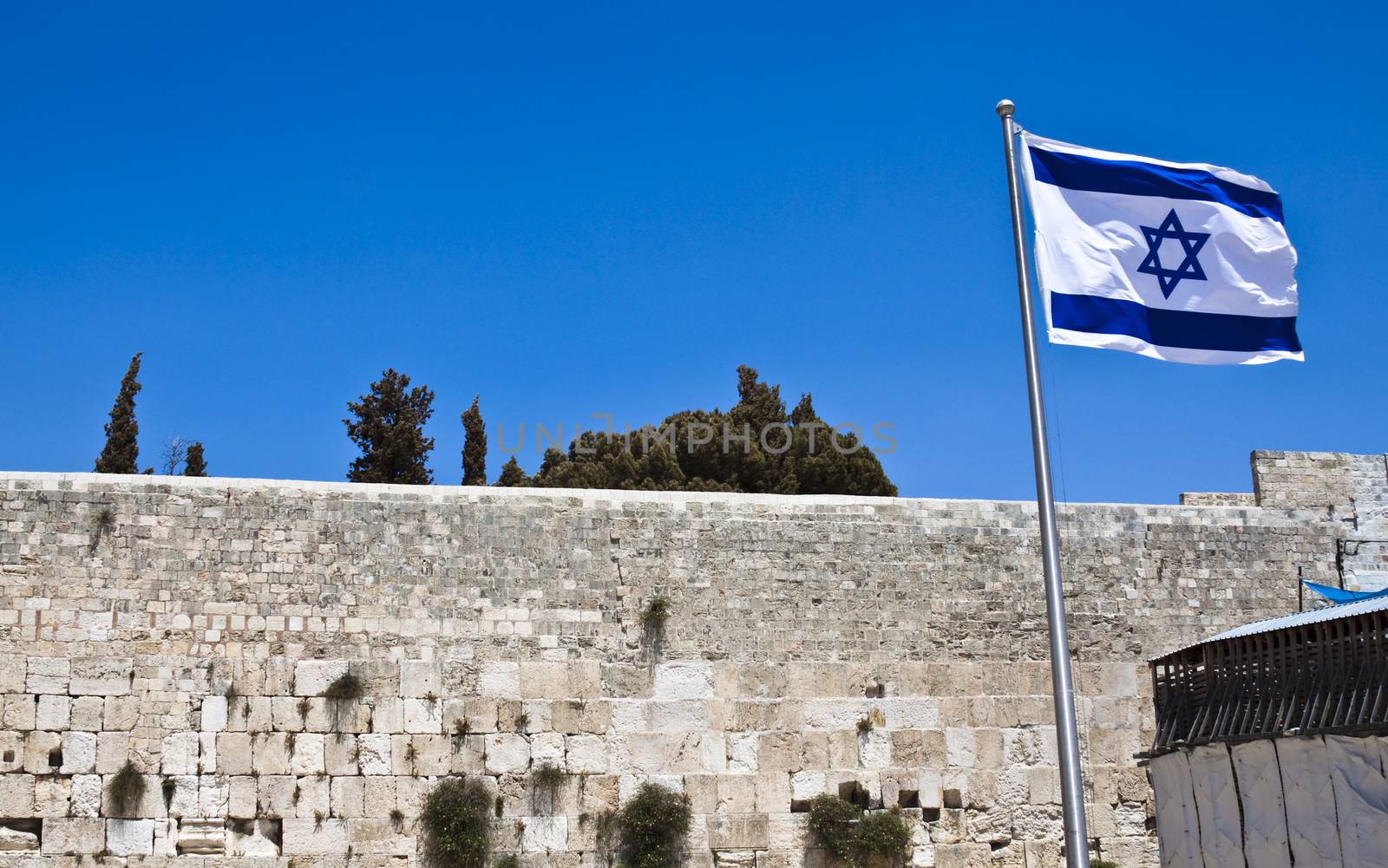 israelian flag and the western wall last standing wall of the second temple