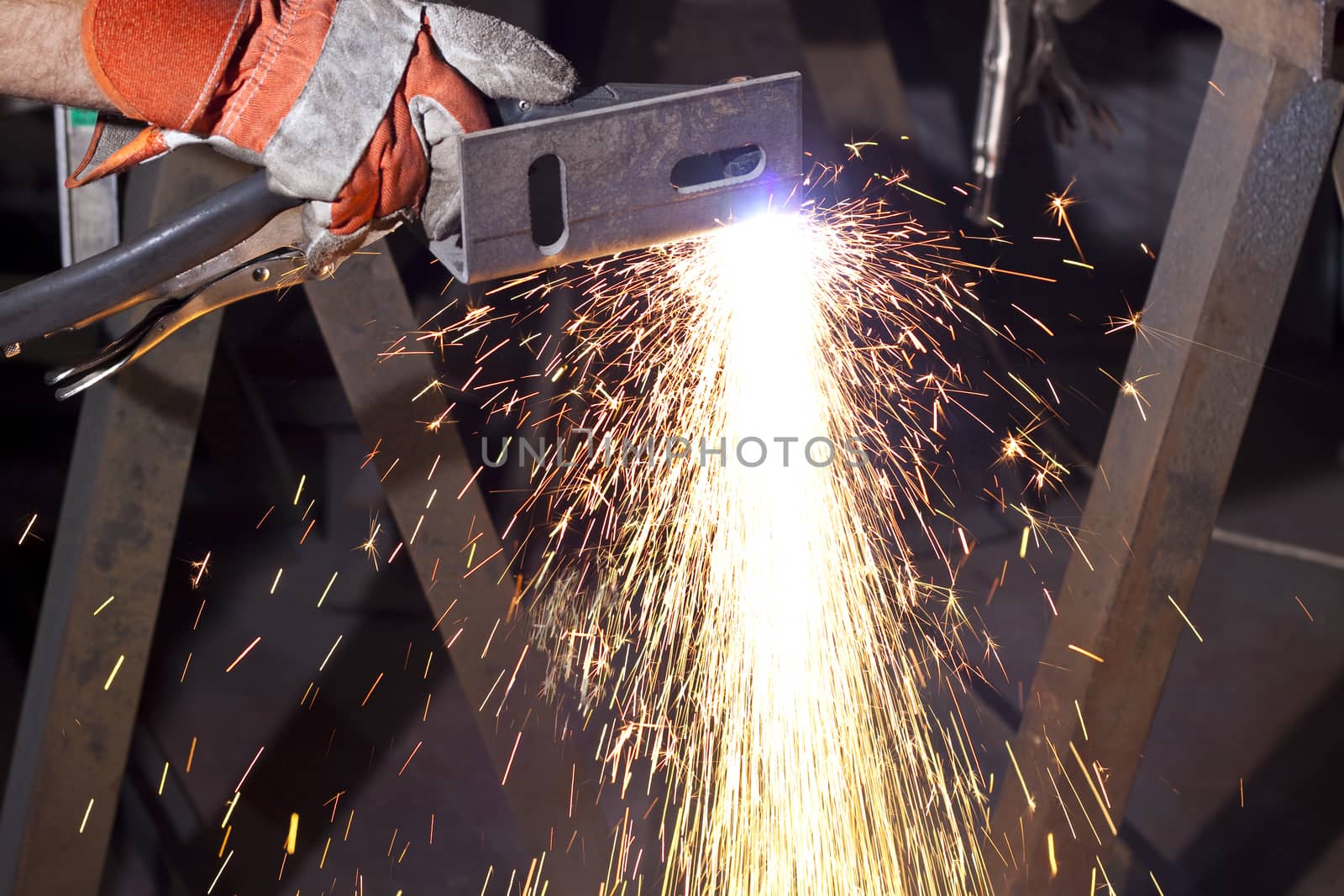 sparks made while plasma cutting  steel plate