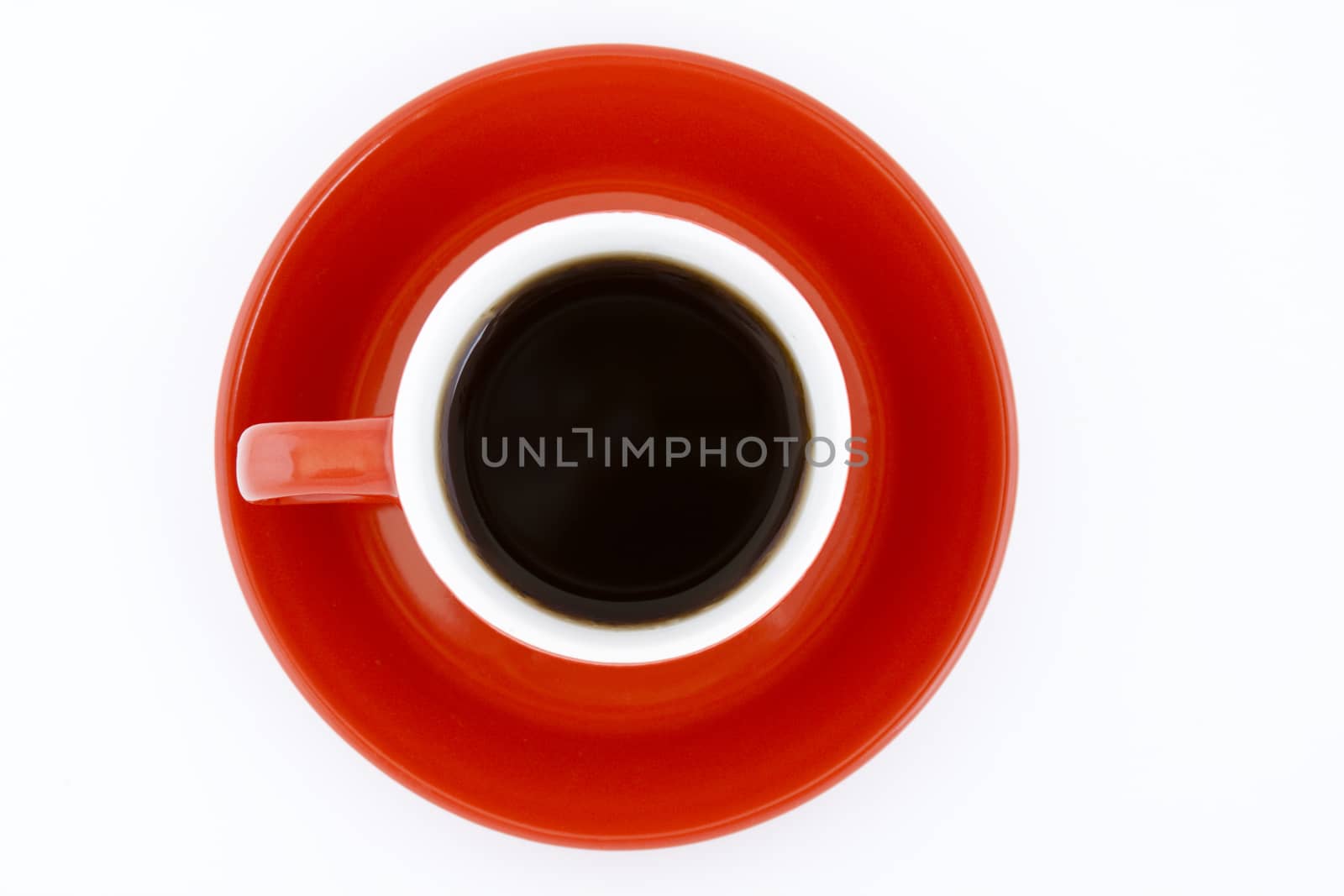 red coffe mug and plate upper view with black coffee on white background